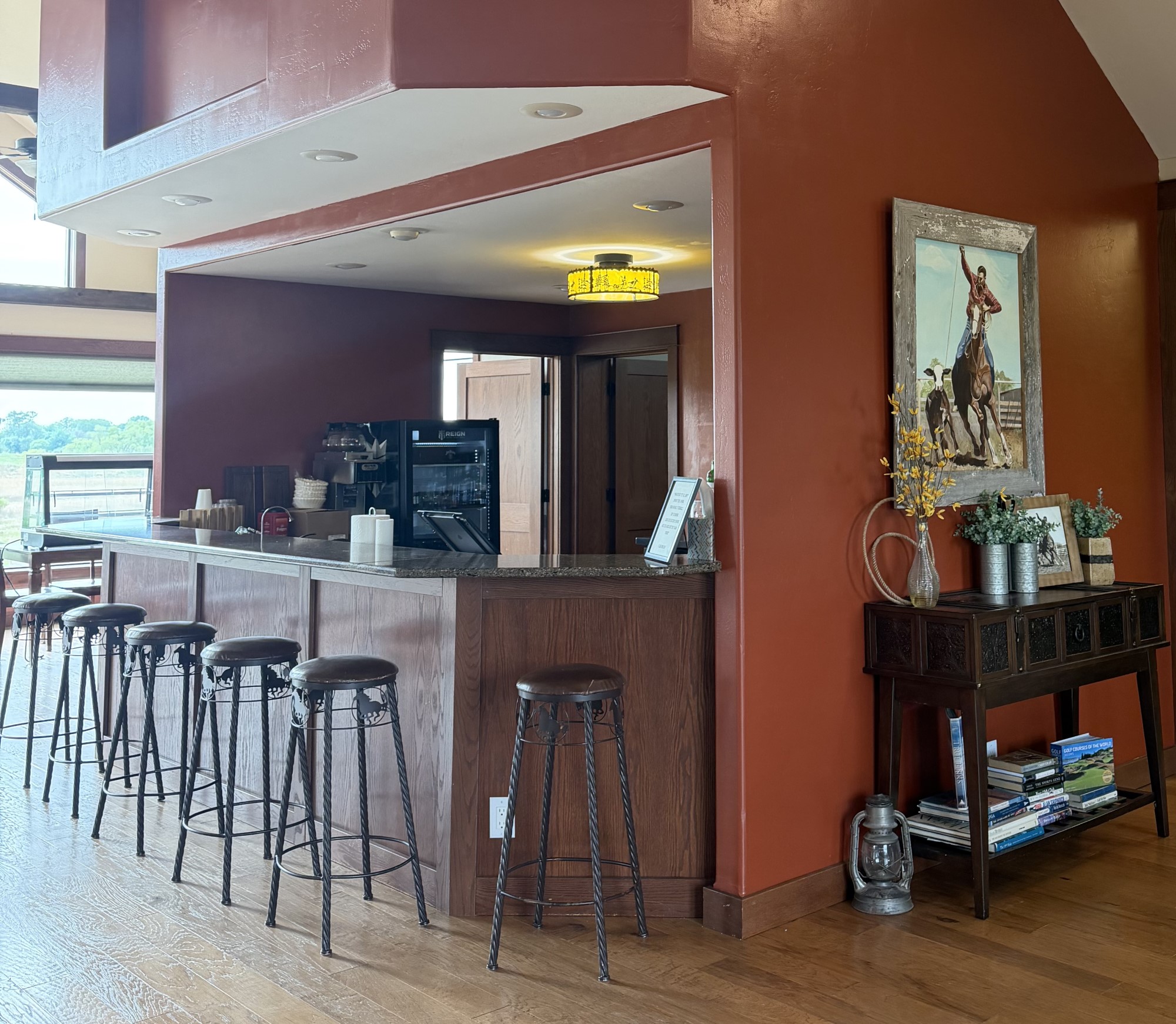 Stools lined up at the Lost Cowboy Bar at Nebraska Dunes.